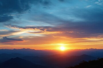 Vibrant sunset over layered mountain ranges with glowing sun and dramatic cloud formations creating serene and awe-inspiring atmosphere