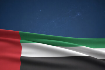 United Arab Emirates flag waving proudly against a starlit sky with copy space above, symbolizing national pride and international relations