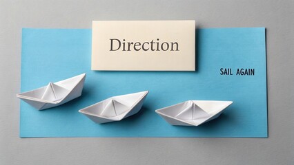 Paper boats on blue background with direction sign conveying messages of navigation, creativity, and journey in life