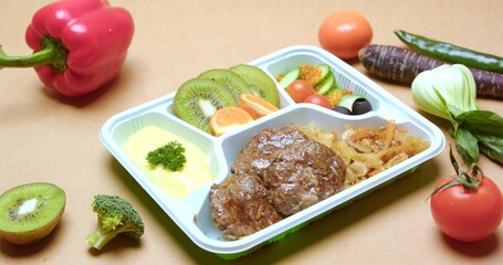 Healthy Meal Prep Container with Meatballs, Fruits, and Vegetables