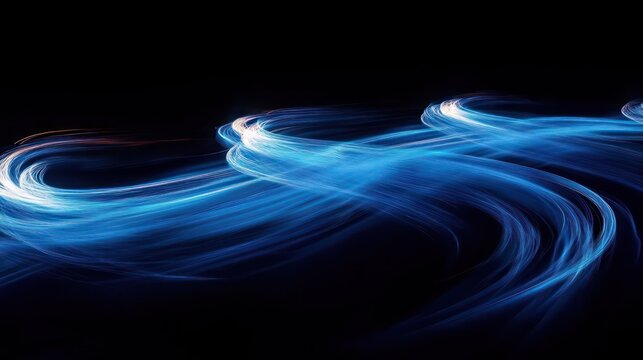 Abstract swirling blue light trails on a dark background conveying movement and energy