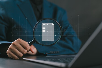 Businesswoman inspection paperwork with magnifier. A business analysis concept.