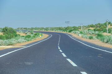 Road through the desert between Jaisalmer and Tanot, near Jaisalmer India.