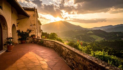Panoramic shot of hillside village at sunset with stunning mountainous landscape