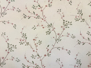 Close up of floral tree branches and foliage leaves printed wallpaper. Suitable for wall covering and other graphic background. Seamless background texture.