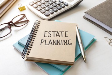 Notebook labeled Estate Planning on a desk with a calculator