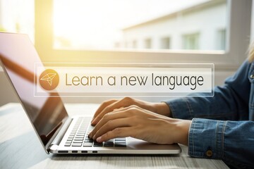 Person typing Learn a new language on a laptop computer