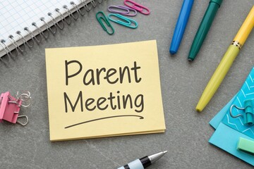 Sticky Note with Parent Meeting Written on Top of Desk