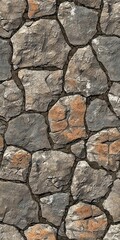 Textured stone wall with various rocks in earthy tones, ideal for backgrounds.