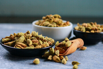 Dry cardamom seeds in a bowl on the table