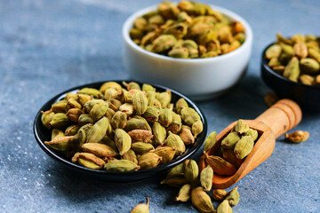 Dry cardamom seeds in a bowl on the table