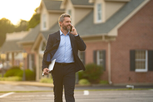 A realtor hands keys to a homeowner. Real estate agent inspects an apartment interior. Agent explains property financing. A real estate broker stands confidently outside a residential building.