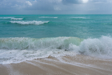 Sea beach sand. Scenic sea beach backdrop. Paradise ocean view. Foamy sea beach background. Exotic ocean. Open sea beach horizon. Relaxing waves. Summer background.