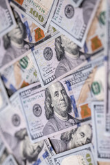 Money background with 100-dollar bills. Texture of US currency. 100 USD banknotes background. American hundred-dollar notes background. Pattern of US dollars for finance concept. Cash background.