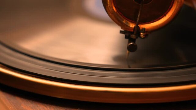 Retro vinyl gramophone from the 1920s with a brass horn and manual spring drive mechanism, producing warm analog sound without electricity, symbolizing antique music elegance and charm