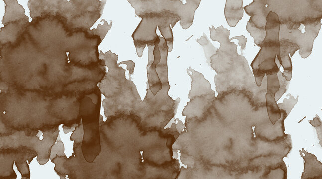 Natural coffee stains and splatters on white paper, organic abstract pattern created by spilled beverage drops forming shapes