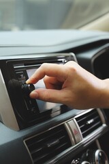 Obraz premium hand control car interior dashboard and steering wheel