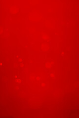 blurred red glitter vintage lights background.  Red bokeh shiny on dark background. Vertical photos