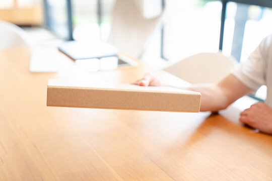 Businessman using data folder paper work siting on table in modern home office
