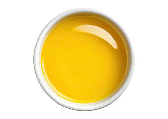 Yellow liquid in white bowl, top view, minimalist
