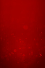 blurred red glitter vintage lights background.  Red bokeh shiny on dark background. Vertical photos