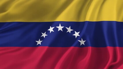 Venezuela national flags waving on a clear day. Yellow, blue and red stripes with 