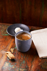 Cup of coffee on rustic wooden background. Soft focus. Copy space	
