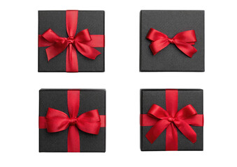 Four black boxes with red satin ribbons on black background
