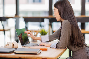 Education, portrait and student woman in library of college campus for learning or study. Books, scholarship and tablet with happy person at university for assignment, development or research
