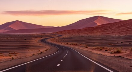 Road winding through desert landscape at sunset in Namibia