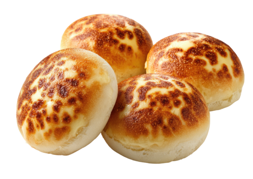 Pile of four rounded, golden-spotted, crusty buns