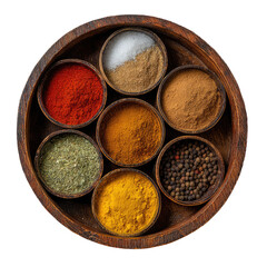 Seven small bowls of various spices and salt arranged in a circular wooden tray, viewed from above