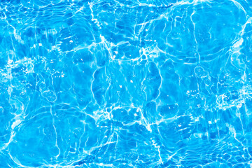 Blue water with ripples on the surface. Defocus blurred transparent blue colored clear calm water...