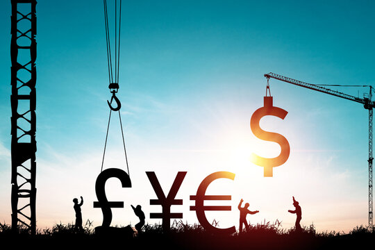 Creative concept of global economy and currency exchange with construction cranes lifting dollar euro yen and pound symbols of building financial growth and international business development. - Powered by Adobe