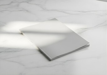 Minimalist Closed Magazine Mockup on White Marble Surface with Natural Light