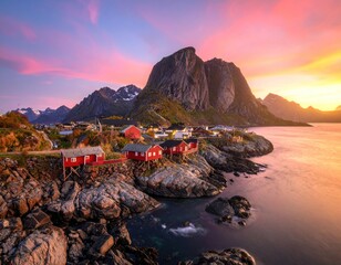 Scenic coastal village under vibrant sunset with mountain backdrop