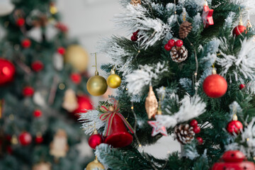 Close up of Christmas decorations on a tree with golden and red balls winter holiday celebration concept photo