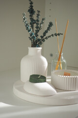 Elegant home decor with vases and candles on a white tray