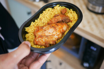 Delicious chicken and rice meal served on a tray