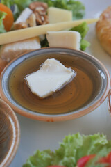 Fresh ingredients on a plate with a dip