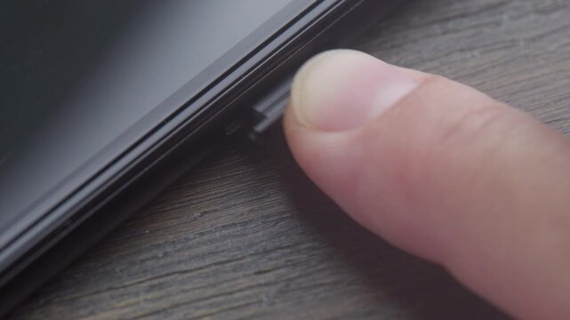 Inserting a modern nano SIM card into a smartphone