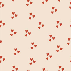 Seamless pattern with small red hearts on beige background. Cute romantic vector design for Valentine’s Day, wrapping paper, textile, wedding decor, or love-themed projects.