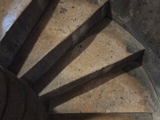 Stone spiral staircase inside an old building
