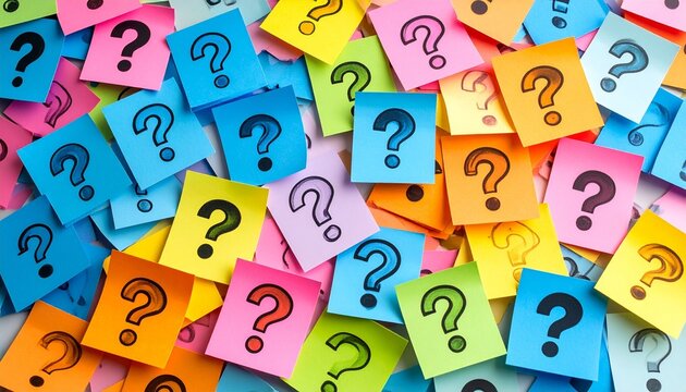 Colorful sticky notes with question marks scattered across surface. - Powered by Adobe