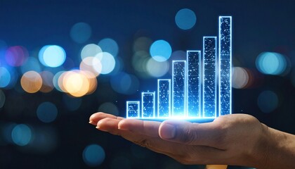 Hand holding holographic bar chart with rising bars against blurred city lights at night.
