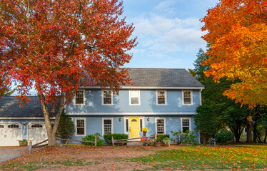residential house with colorful autumn trees
