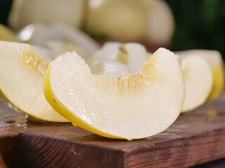 Fresh Sliced Honeydew Melon Wedges on Wooden Cutting Board