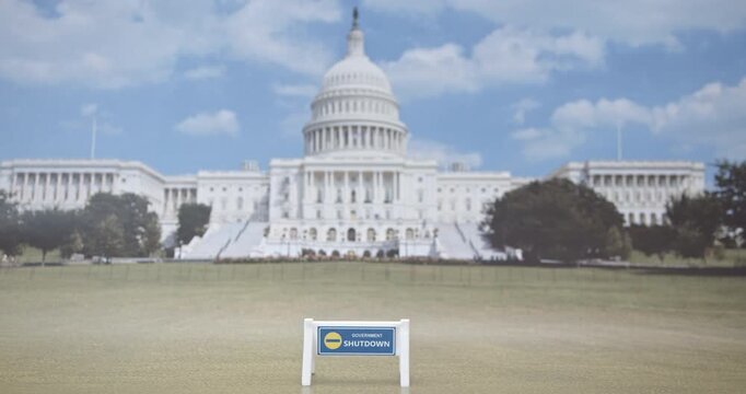 Political Gridlock and Economic Uncertainty : Blue &ldquo;Government Shutdown&rdquo; barrier in front of U.S. Capitol, symbolizing federal funding freeze, political gridlock, and rising economic uncertainty.