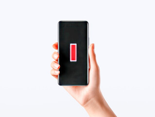 Woman holding a smartphone displaying a low battery warning sign against a clean white background symbolizing urgent charging needs and power depletion