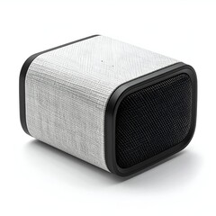 Obraz premium Compact wireless speaker with fabric finish, placed on a wooden surface, enhancing modern home decor